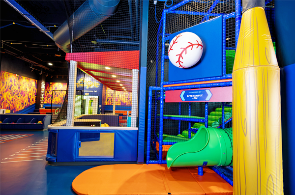 View of Slide exit with baseball and yellow crayon props