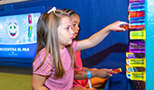 Kids Playing with activity on wall