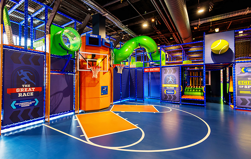 Interior view of the basketball courts, tunnel experience and great race activities at the Zone